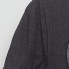 Close-up of the single stitch sleeve on the Vintage 2010s Marvel "Captain America Shield" T-Shirt - L