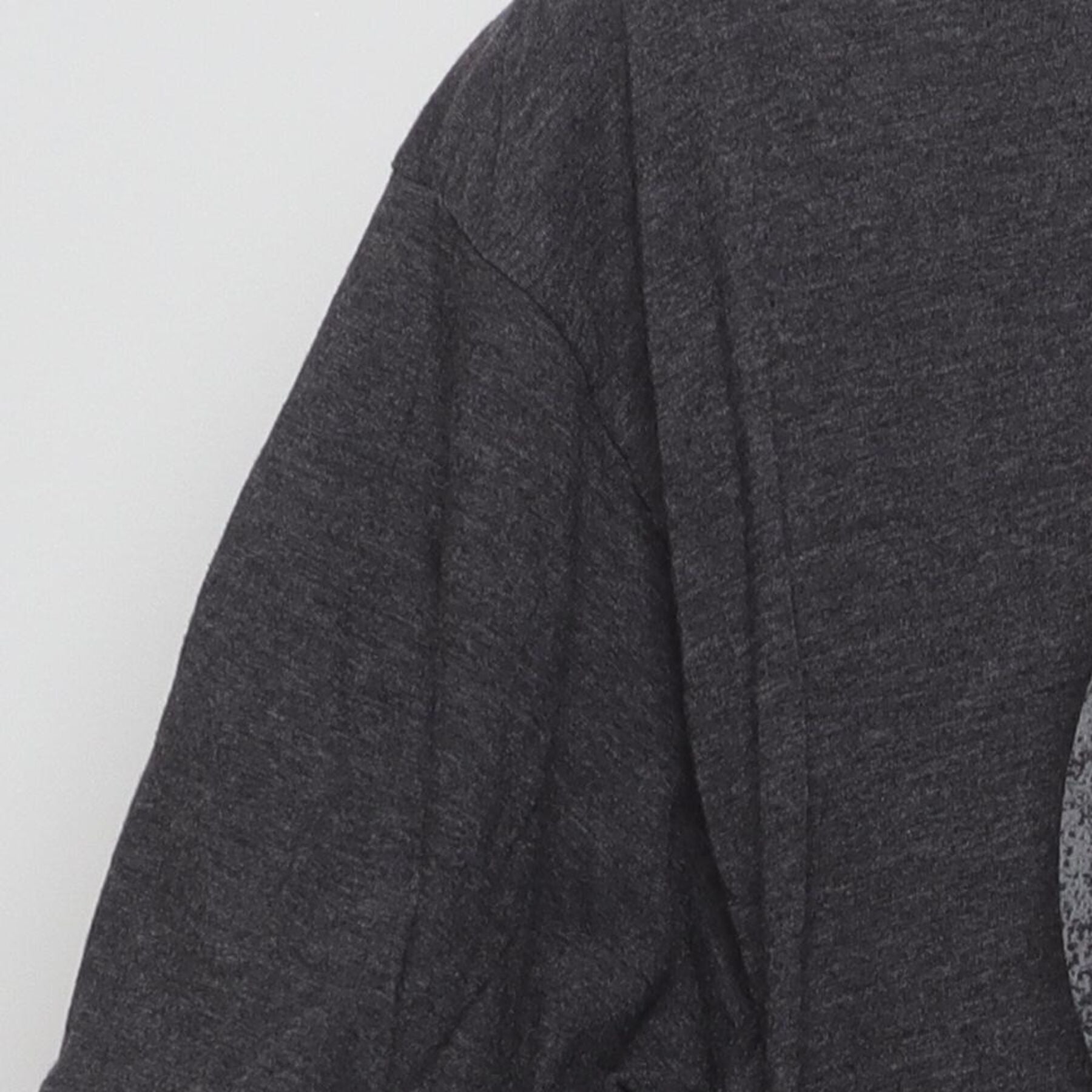 Close-up of the single stitch sleeve on the Vintage 2010s Marvel "Captain America Shield" T-Shirt - L