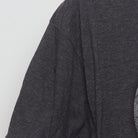 Close-up of the single stitch sleeve on the Vintage 2010s Marvel "Captain America Shield" T-Shirt - L