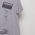 Close-up of the sleeve on the Vintage 2010s Maxell Cassette Graphic T-Shirt L