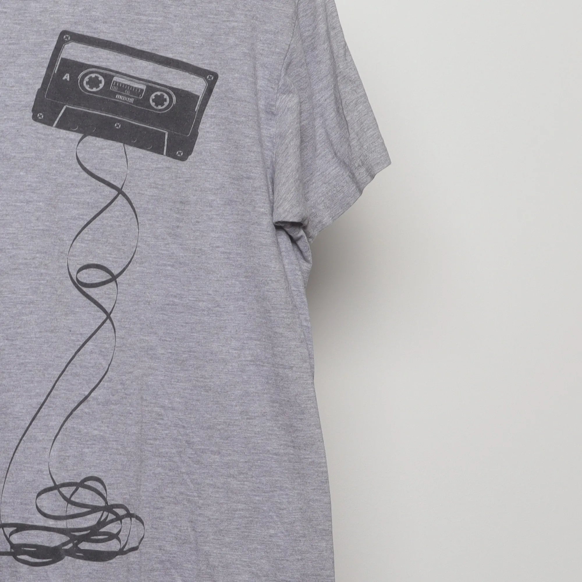 Close-up of the sleeve on the Vintage 2010s Maxell Cassette Graphic T-Shirt L