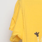 Close-up of the Left sleeve on the Vintage 2010s Despicable Me "Minions Pile" T-Shirt - S