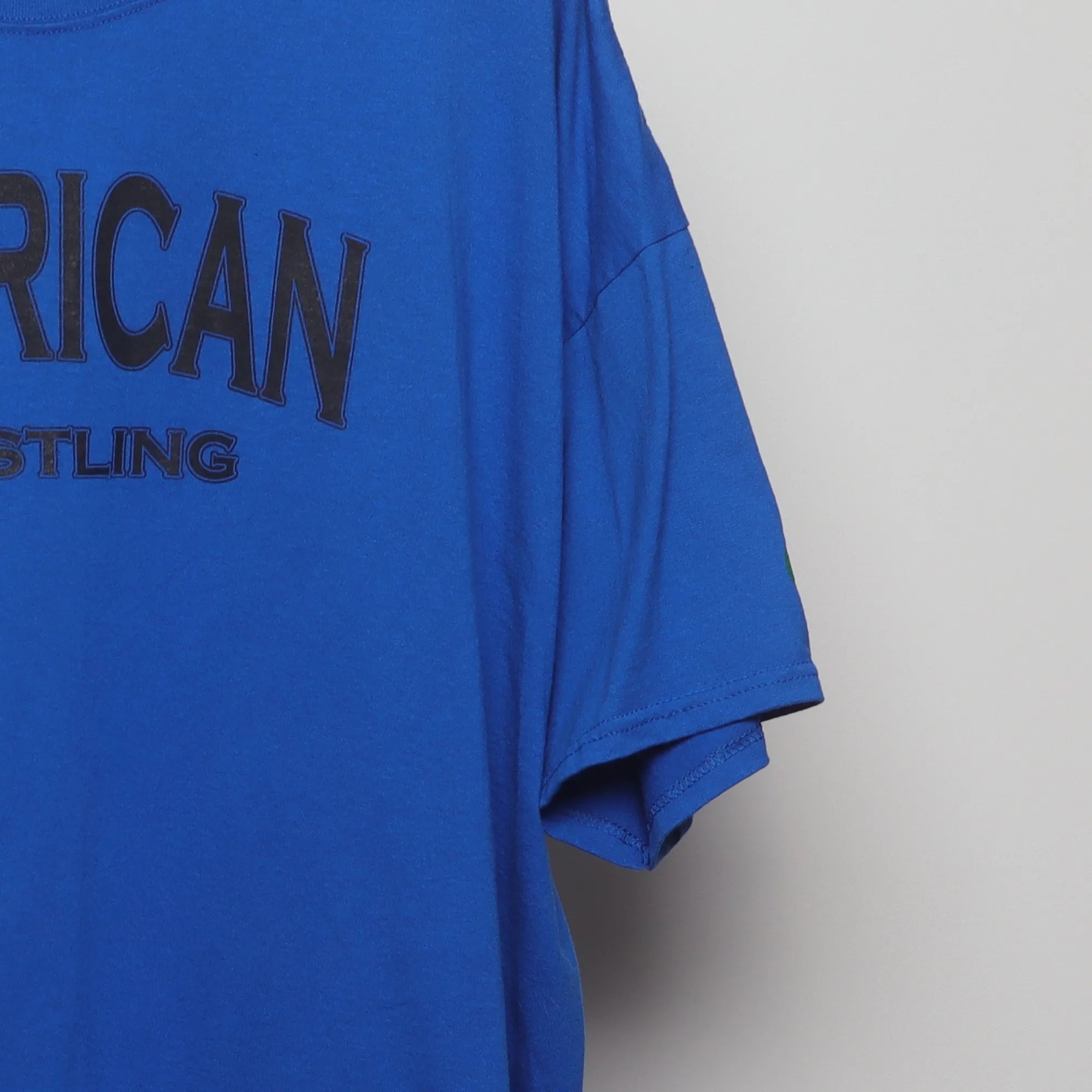 Close-up of the sleeve on the Vintage 2010s NCAA Wrestling MSG Graphic Tee XXL