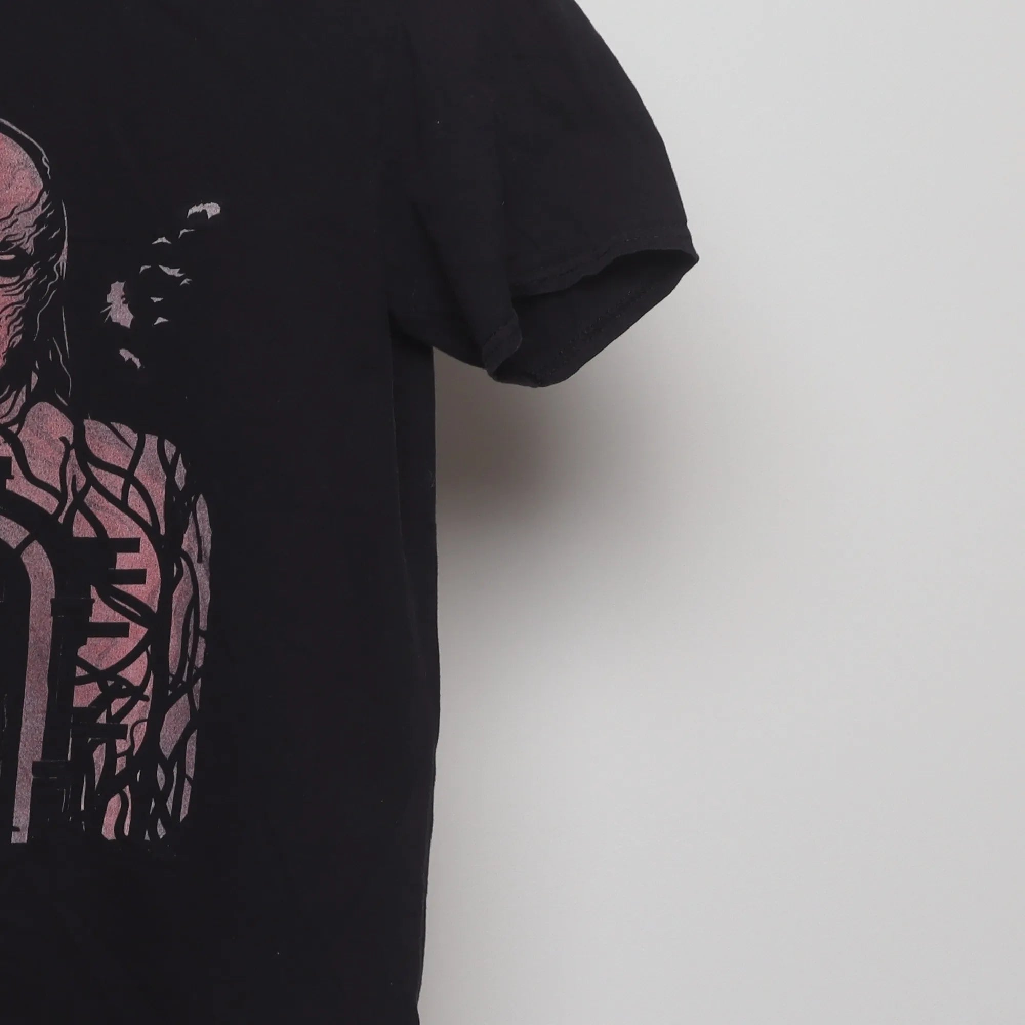 Close-up of the sleeve on the Vintage 2010s Netflix Stranger Things Vecna Tee S