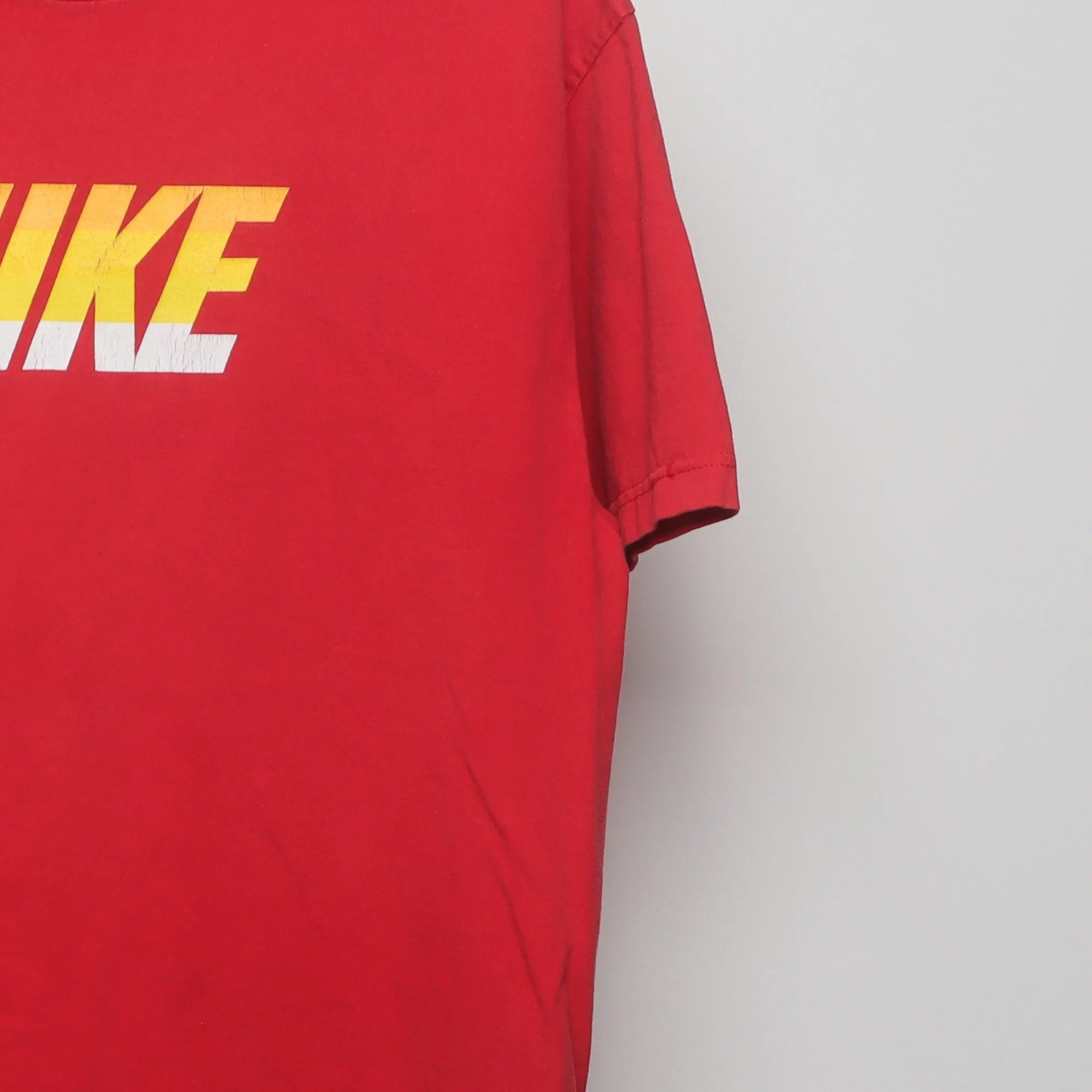 Close-up of the sleeve on the Vintage 2010s Nike Block Logo Graphic T-Shirt L
