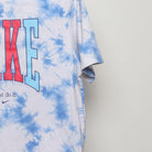 Close-up of the sleeve on the Vintage 2010s Nike Tie-Dye Peace Graphic Tee XL