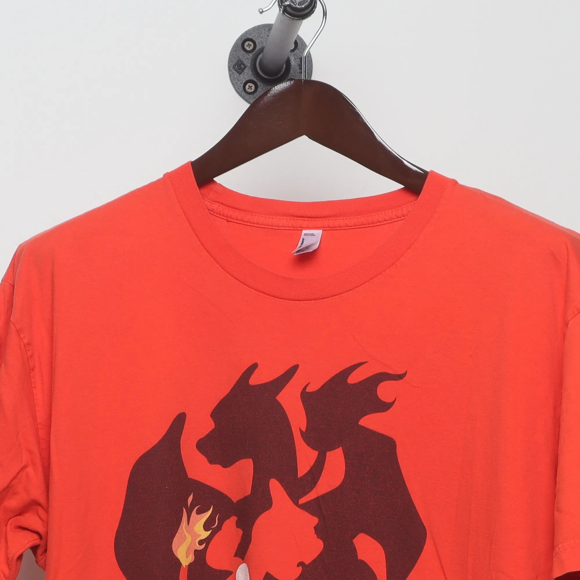 Close-up of the collar and tag on the Vintage 2010s Pokémon Charizard Silhouette Tee XL