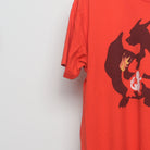 Close-up of the sleeve on the Vintage 2010s Pokémon Charizard Silhouette Tee XL