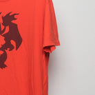 Close-up of the sleeve on the Vintage 2010s Pokémon Charizard Silhouette Tee XL
