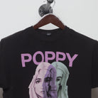 Close-up of the collar and tag on the Vintage 2010s Poppy Glitch Graphic Band T-Shirt L
