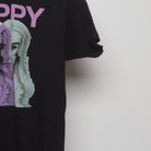 Close-up of the sleeve on the Vintage 2010s Poppy Glitch Graphic Band T-Shirt L