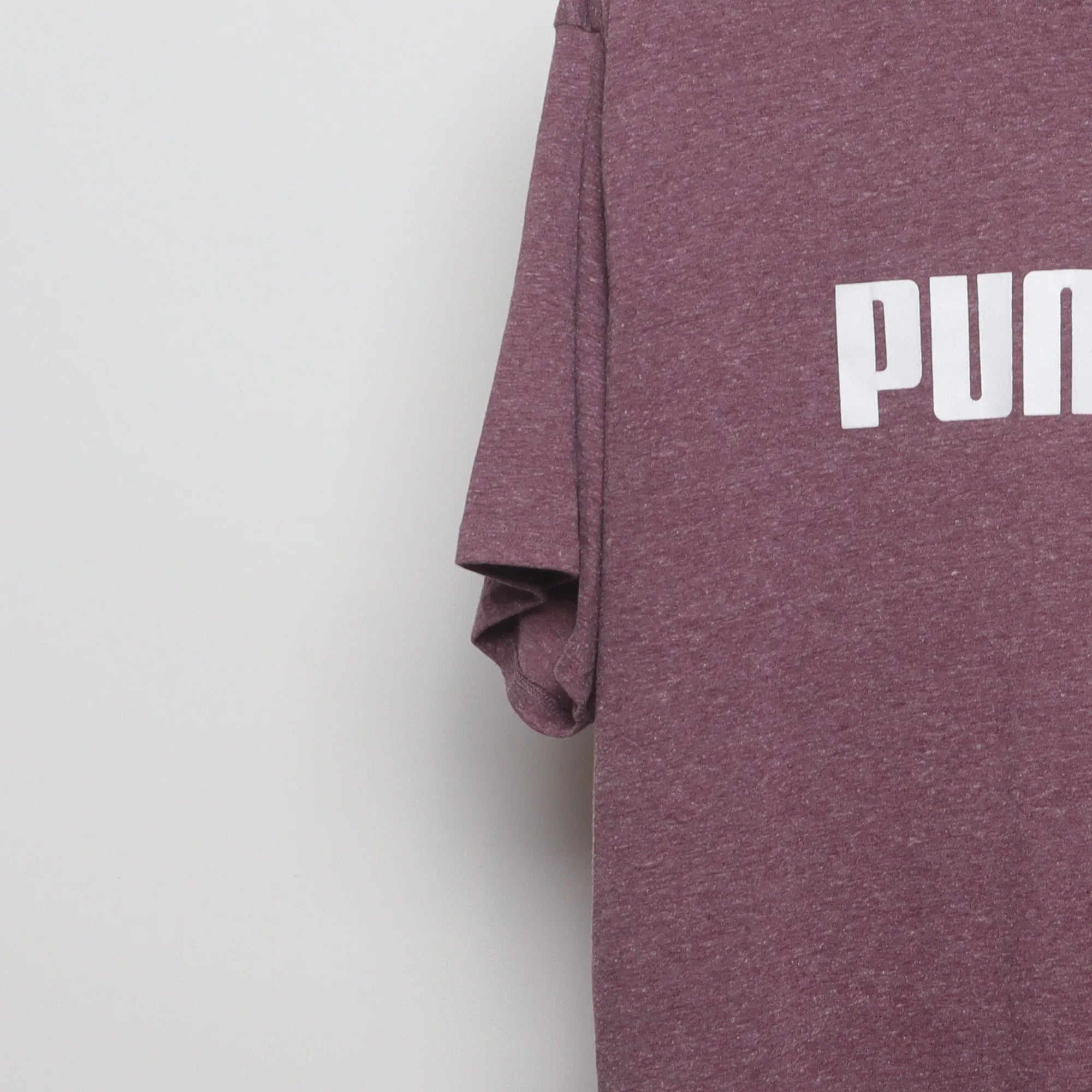 Close-up of the sleeve on the Vintage 2010s Puma Big Logo Heathered T-Shirt XL