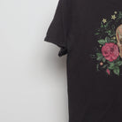 Close-up of the sleeve on the Vintage 2010s Skull & Roses Graphic T-Shirt M