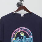 Close-up of the collar and tag on the Vintage 2010s Smoky Mountains Pastel Souvenir T-Shirt L