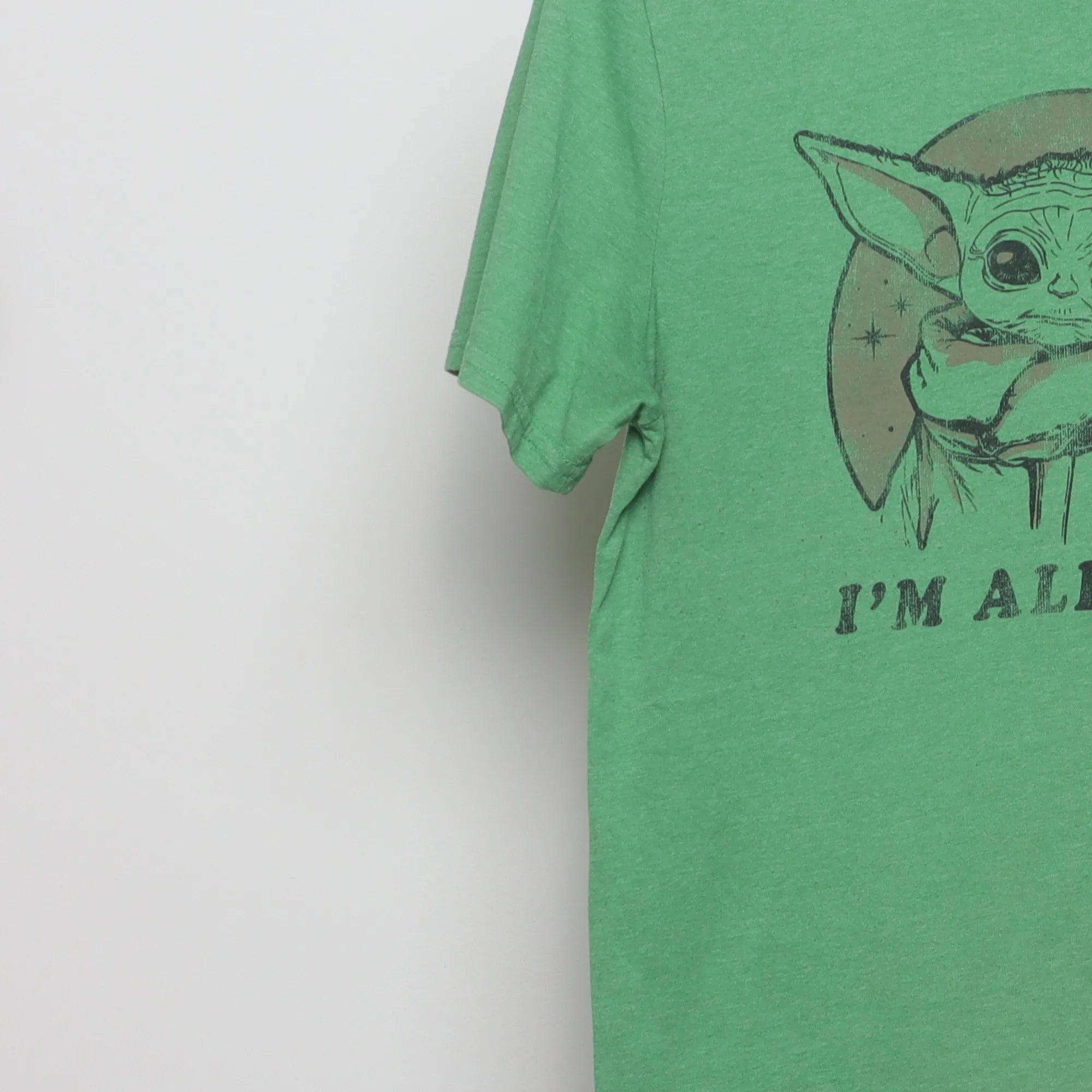 Close-up of the sleeve on the Vintage 2010s Star Wars Grogu 'I'm All Ears' Tee M
