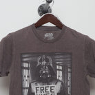 Close-up of the collar and tag on the Vintage 2010s Star Wars Vader Free Hugs T-Shirt S