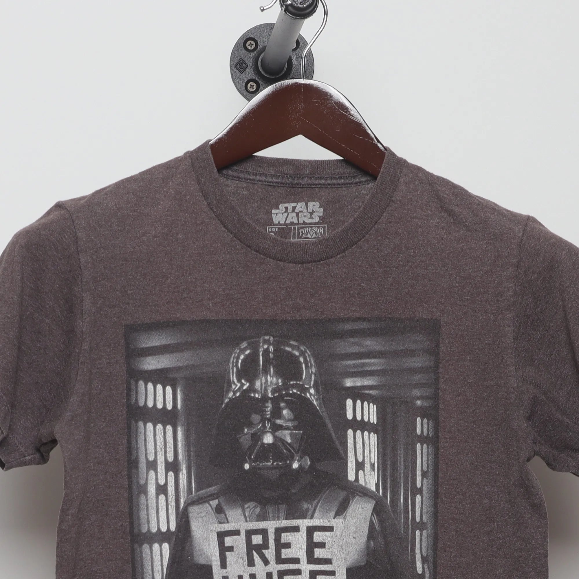 Close-up of the collar and tag on the Vintage 2010s Star Wars Vader Free Hugs T-Shirt S