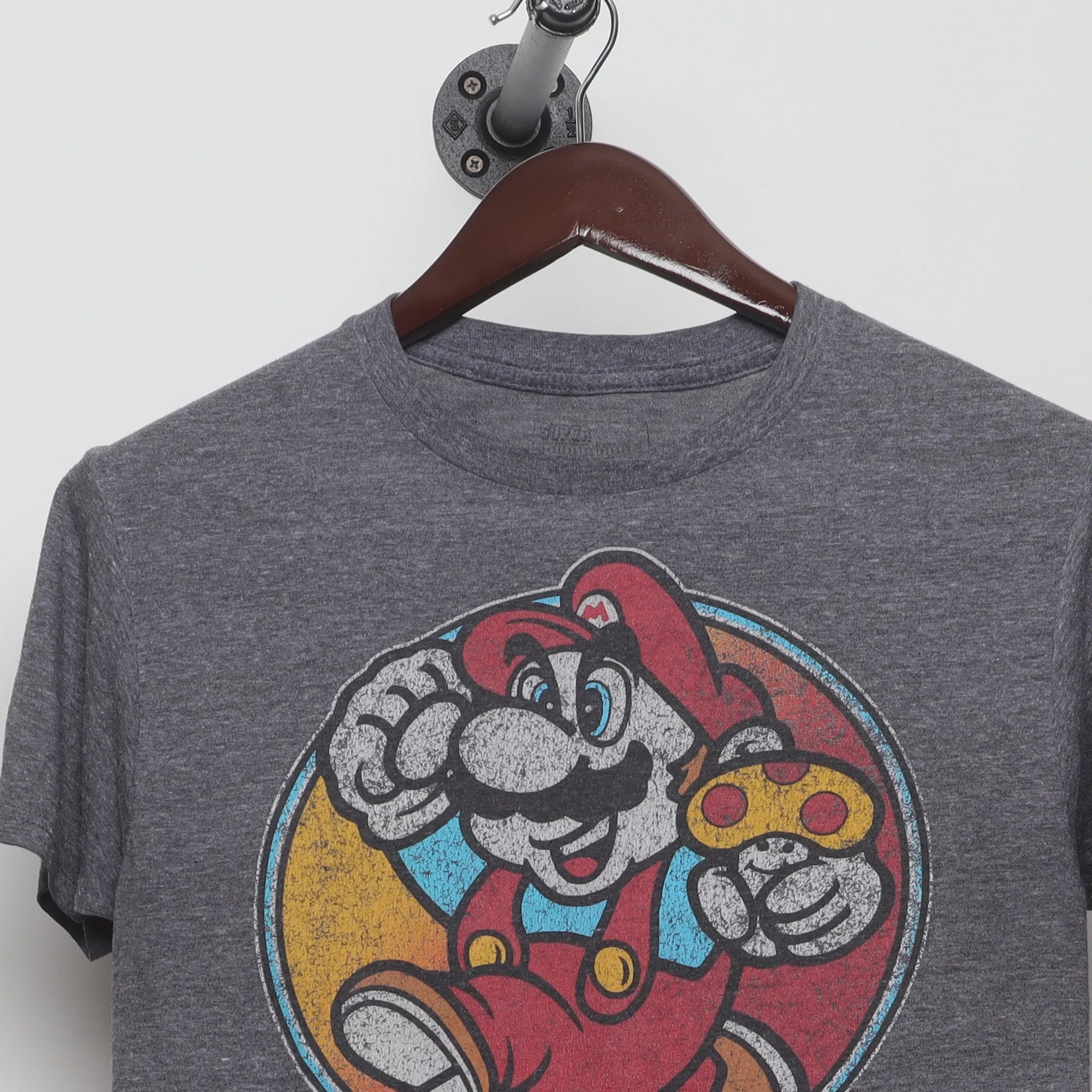 Close-up of the collar and tag on the Vintage 2010s Super Mario Gamer Graphic T-Shirt S