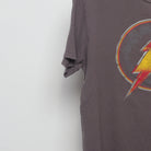 Close-up of the sleeve on the Vintage 2010s The Flash Distressed Logo T-Shirt L