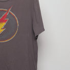 Close-up of the sleeve on the Vintage 2010s The Flash Distressed Logo T-Shirt L