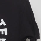 Close-up of the sleeve on the Vintage 2010s The Office "Schrute Farms" T-Shirt - XL