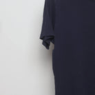 Close-up of the sleeve on the Vintage 2010s Uniqlo Nintendo Mario Pocket T-Shirt L