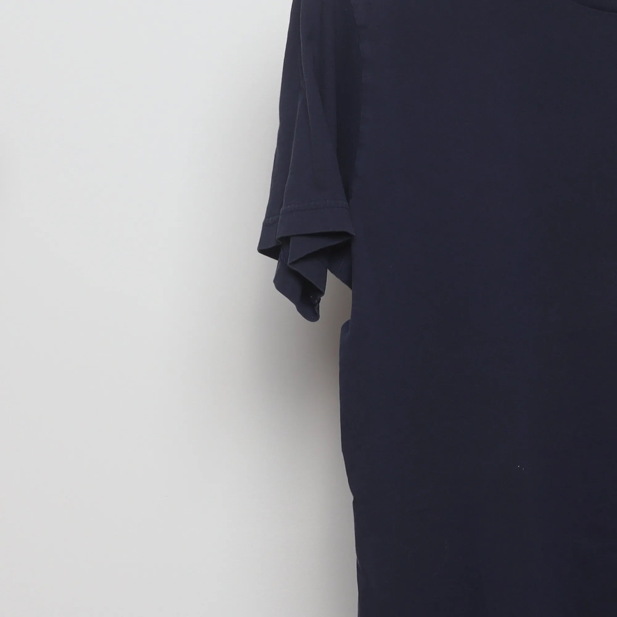 Close-up of the sleeve on the Vintage 2010s Uniqlo Nintendo Mario Pocket T-Shirt L