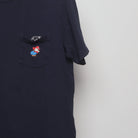 Close-up of the sleeve on the Vintage 2010s Uniqlo Nintendo Mario Pocket T-Shirt L