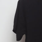 Close-up of the sleeve on the Vintage 2010s White Claw "Wave Logo" T-Shirt - S