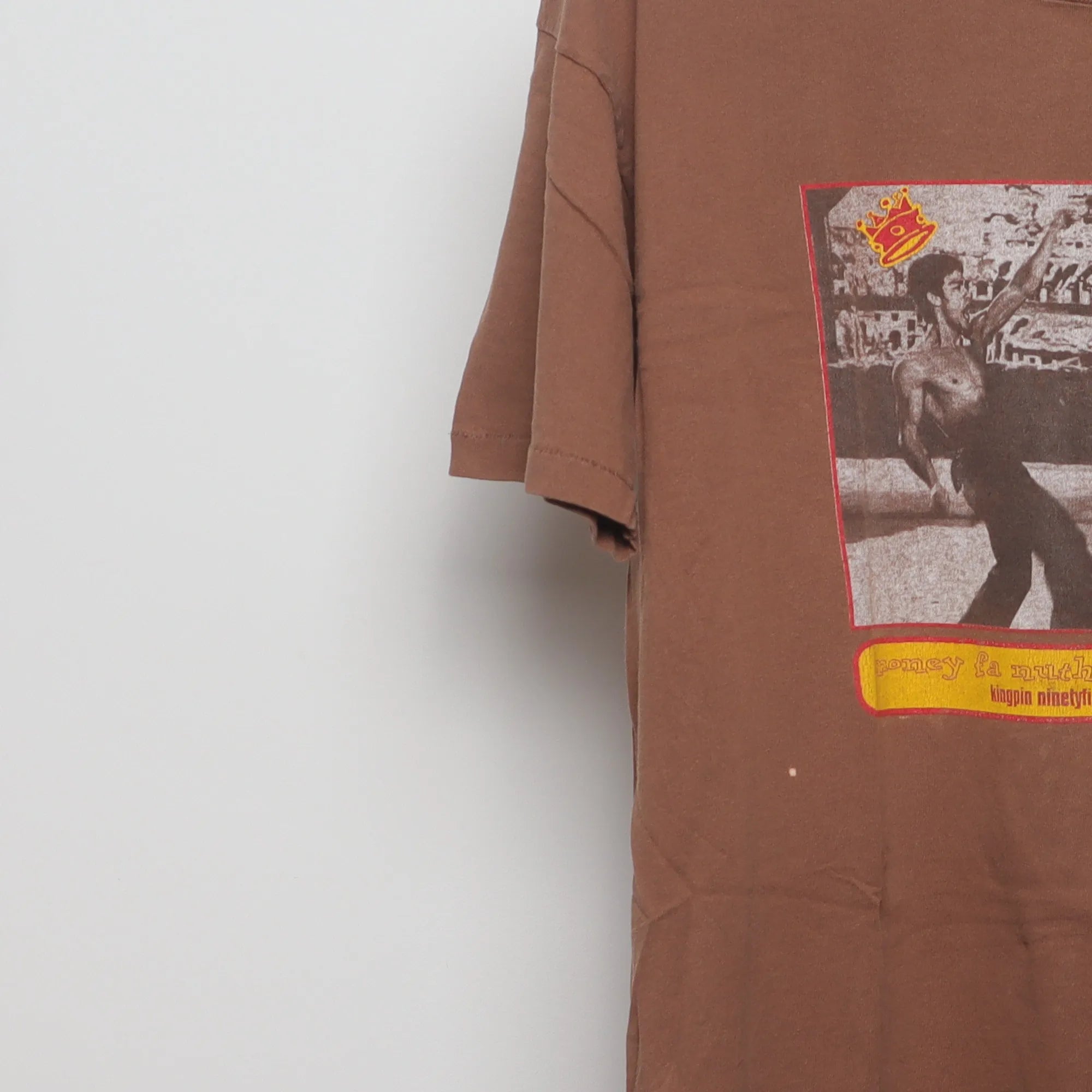 Close-up of the sleeve on the Vintage 90s Bruce Lee Soulflexin Single Stitch Tee XL
