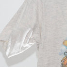 Close-up of the Left sleeve on the Vintage 1990s Disney Winnie the Pooh "Pooh's Hayride" T-Shirt - S