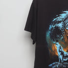 Close-up of the sleeve on the Vintage 90s Howling Wolf Native Chief Graphic T-Shirt L