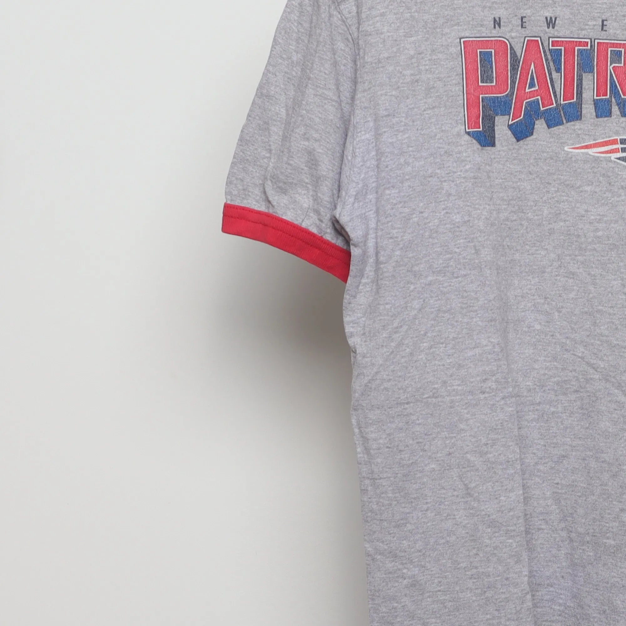 Close-up of the sleeve on the Vintage 90s New England Patriots Ringer T-Shirt M