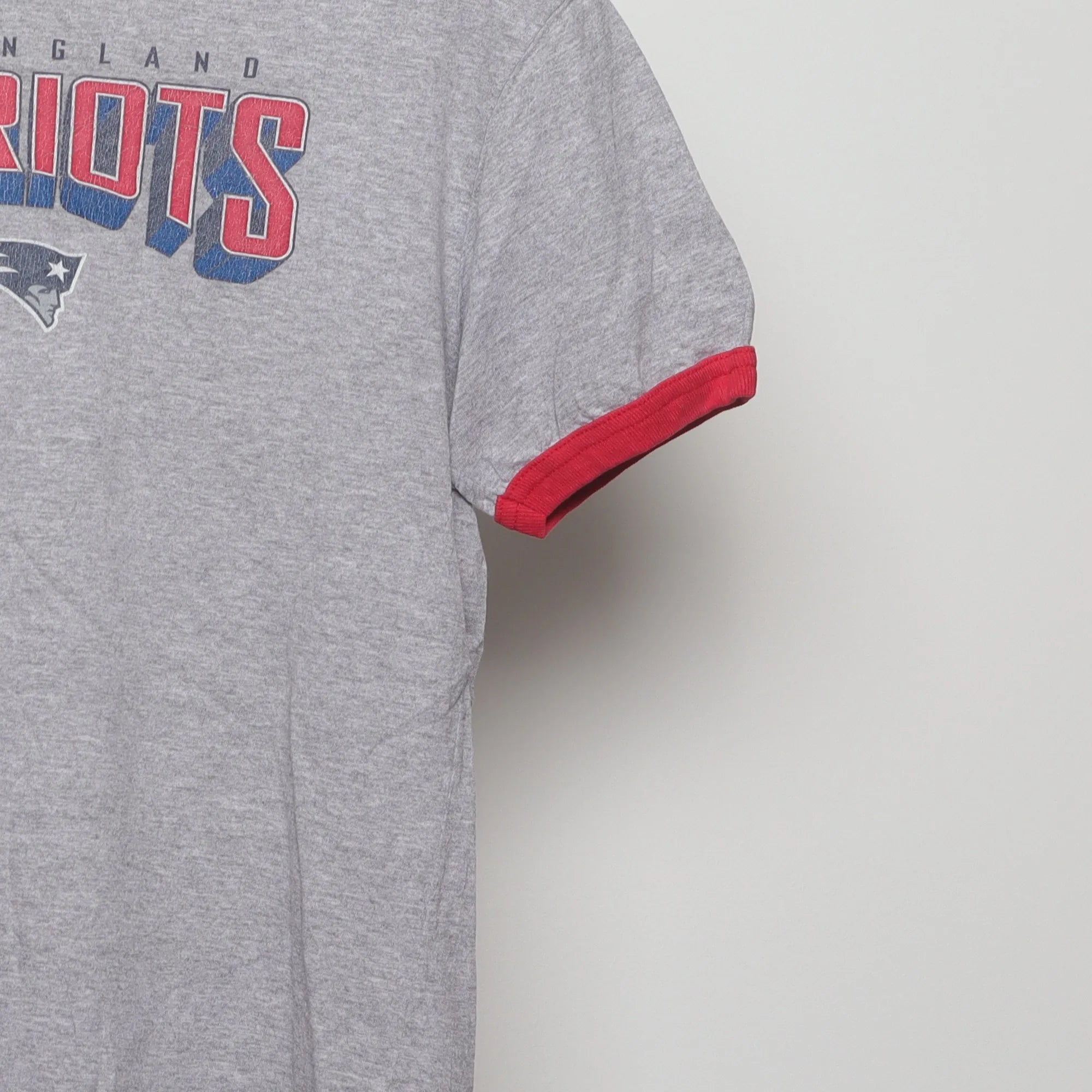 Close-up of the sleeve on the Vintage 90s New England Patriots Ringer T-Shirt M