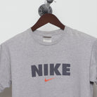 Close-up of the collar and tag on the Vintage 90s Nike Block Logo Swoosh T-Shirt M