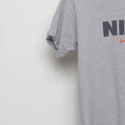Close-up of the sleeve on the Vintage 90s Nike Block Logo Swoosh T-Shirt M
