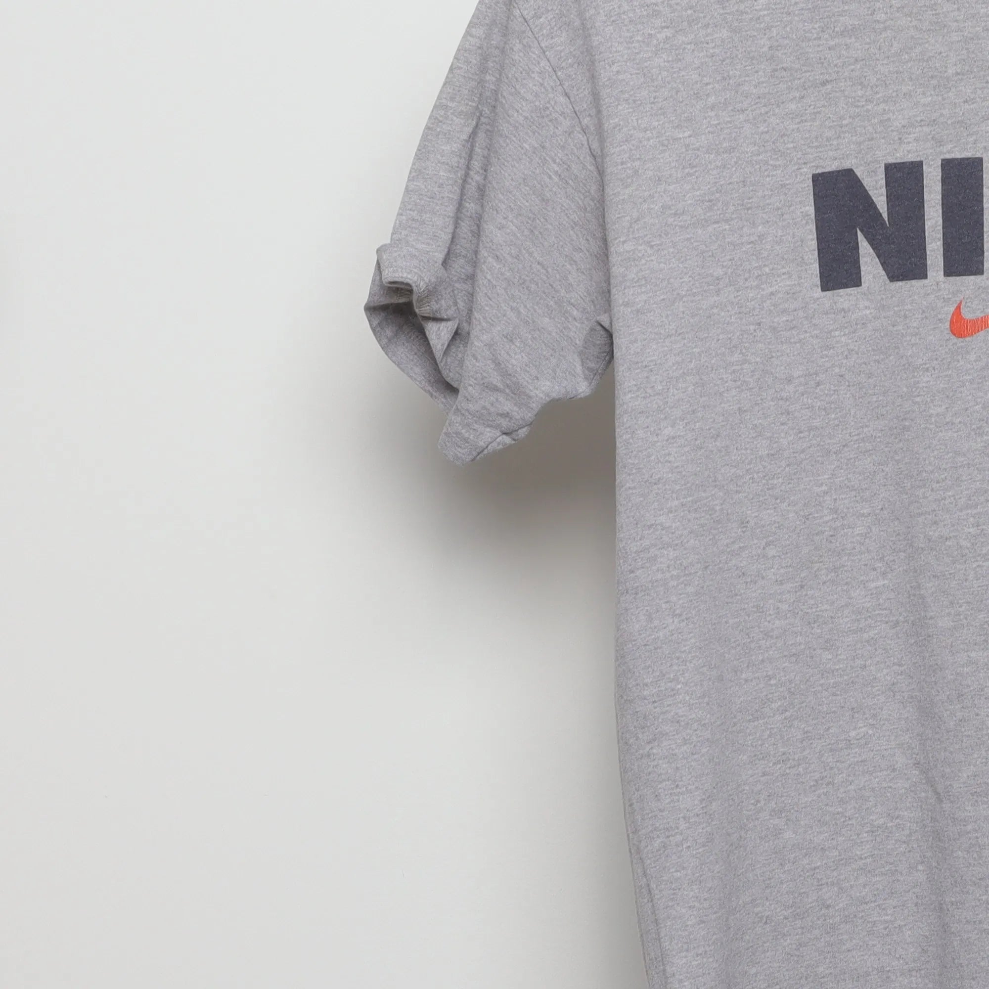Close-up of the sleeve on the Vintage 90s Nike Block Logo Swoosh T-Shirt M