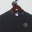 Close-up of the collar and tag on the Vintage 1990s Nike "Jacksonville Jaguars Mock Neck" T-Shirt - M