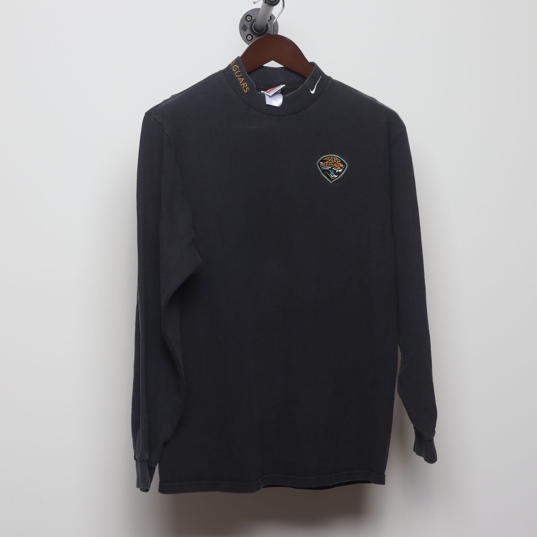 Front view of Vintage 1990s Nike "Jacksonville Jaguars Mock Neck" T-Shirt - M