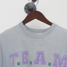 Close-up of the collar and tag on the Vintage 1990s T.E.A.M. "Athletic Equipment" T-Shirt - XL