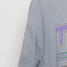 Close-up of the Left sleeve on the Vintage 1990s T.E.A.M. "Athletic Equipment" T-Shirt - XL