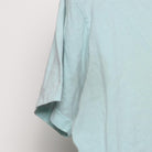 Close-up of the Left sleeve on the Vintage Y2K Ben & Jerry's "Founders Portrait" T-Shirt - S