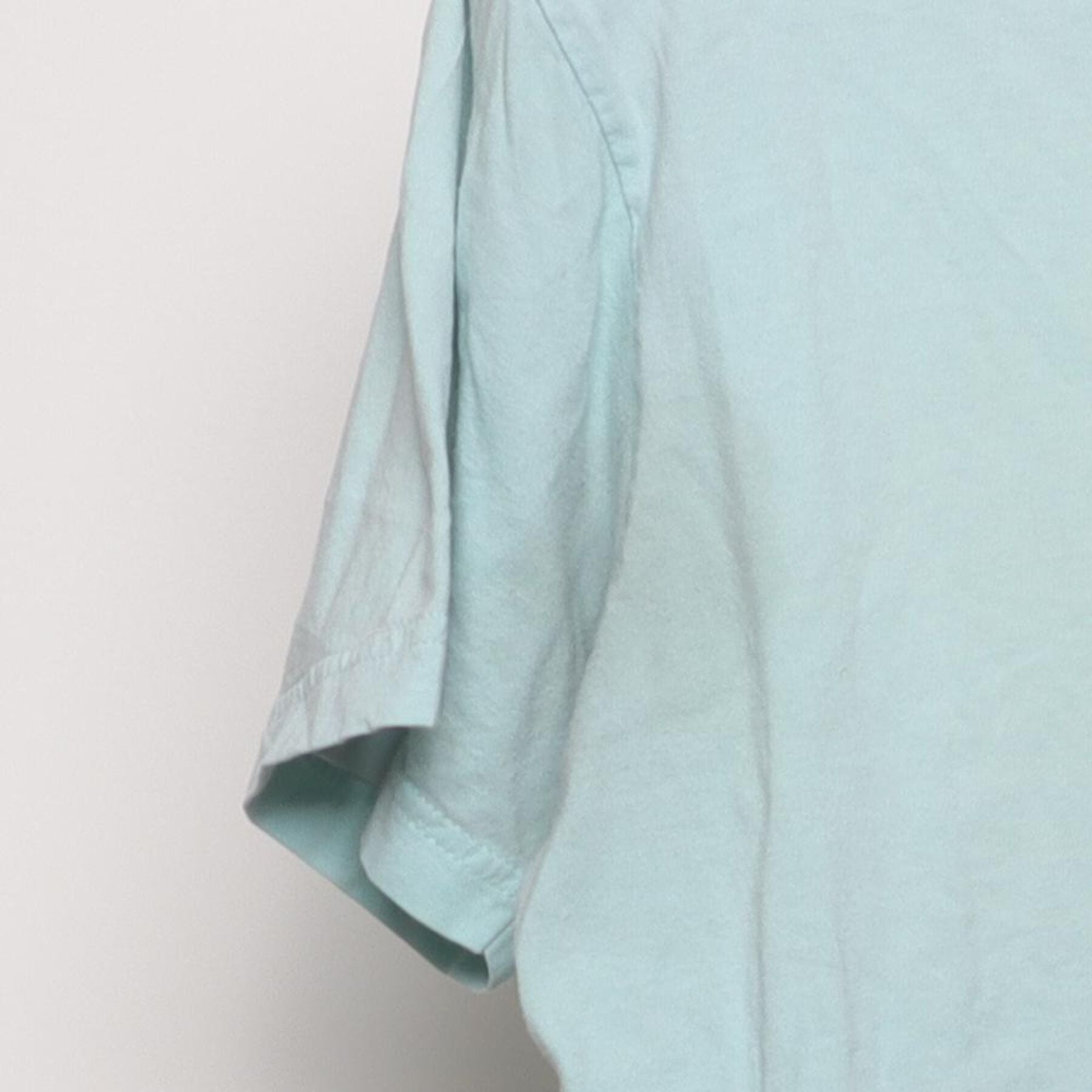 Close-up of the Left sleeve on the Vintage Y2K Ben & Jerry's "Founders Portrait" T-Shirt - S