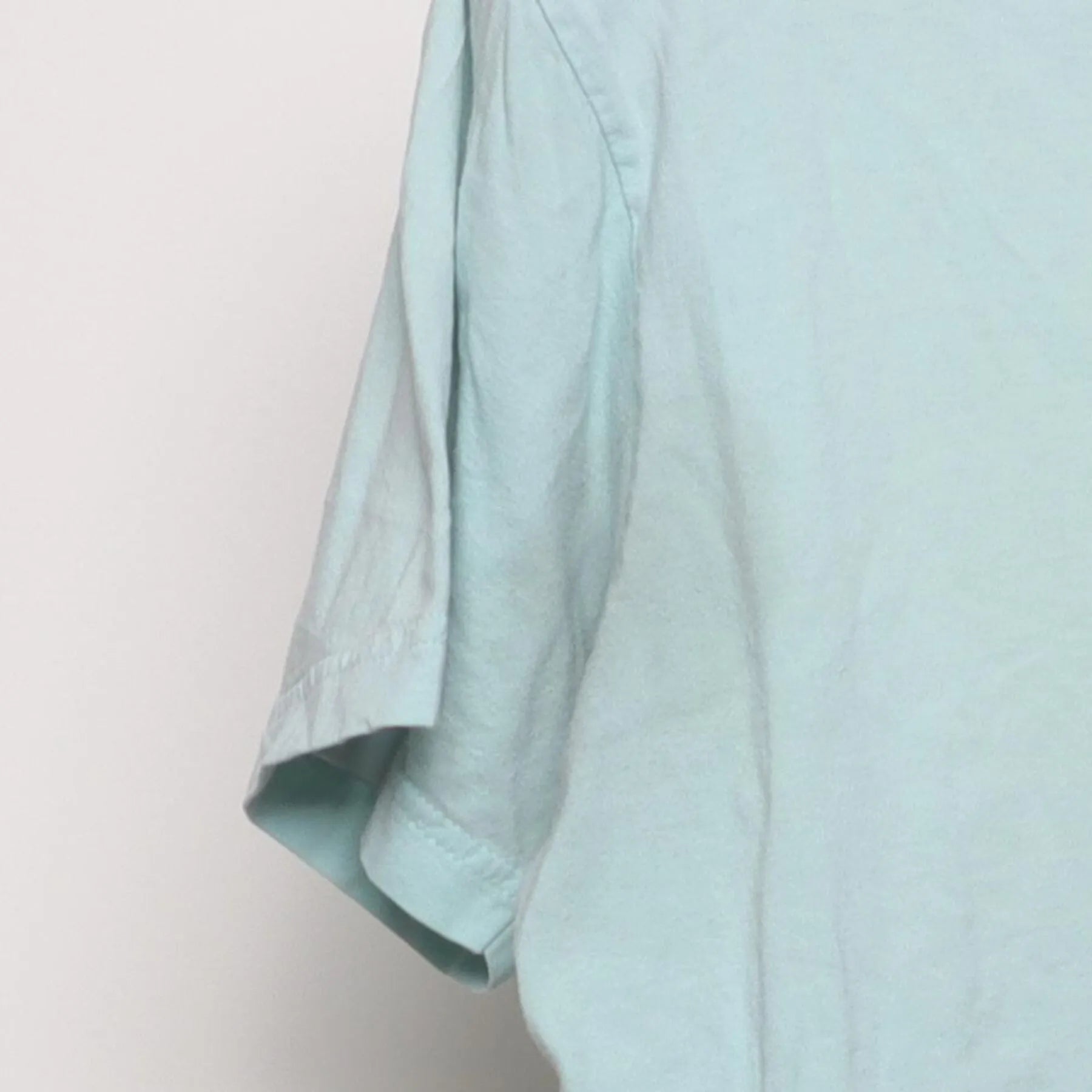 Close-up of the Left sleeve on the Vintage Y2K Ben & Jerry's "Founders Portrait" T-Shirt - S