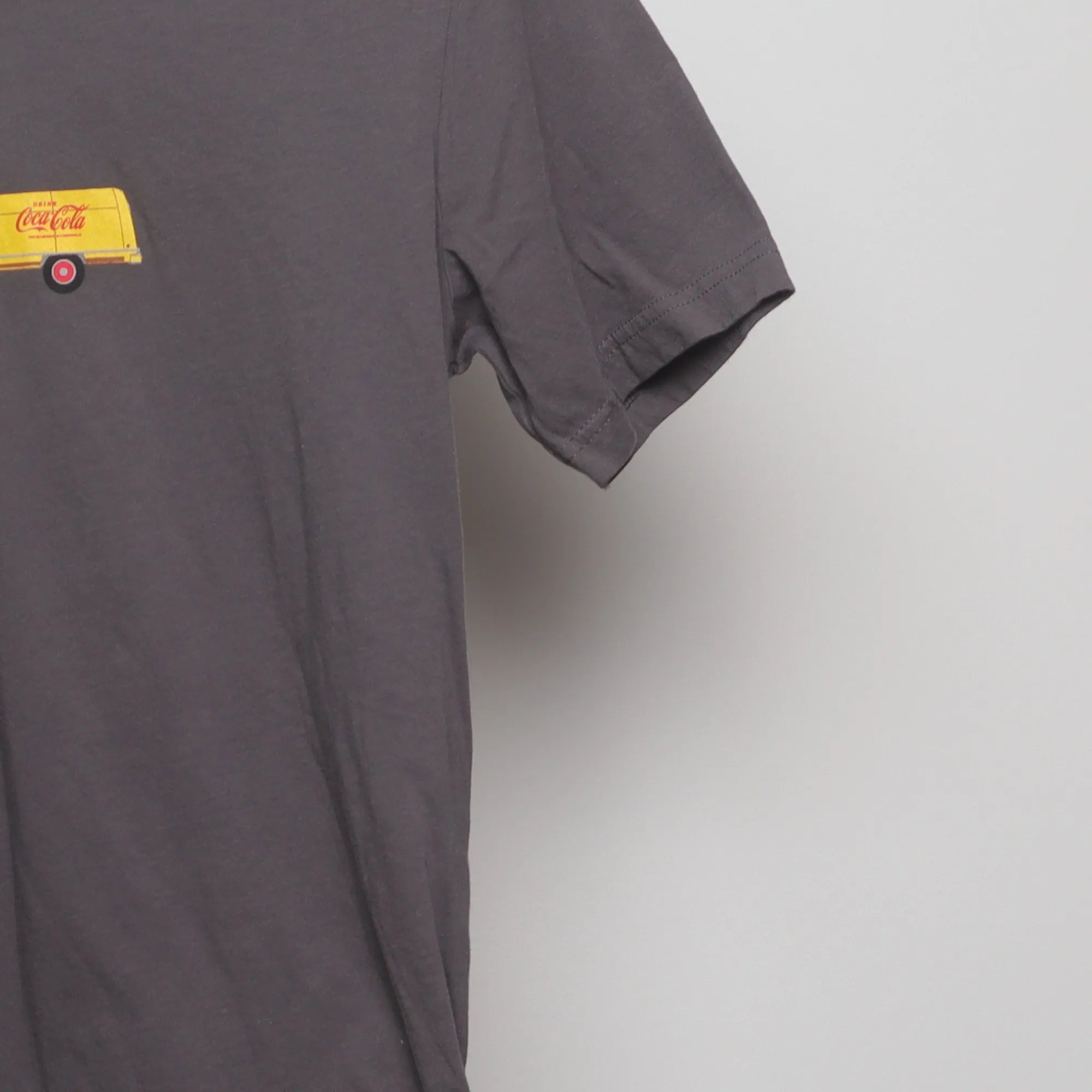 Close-up of the sleeve on the Vintage Coca-Cola Delivery Truck Graphic T-Shirt L