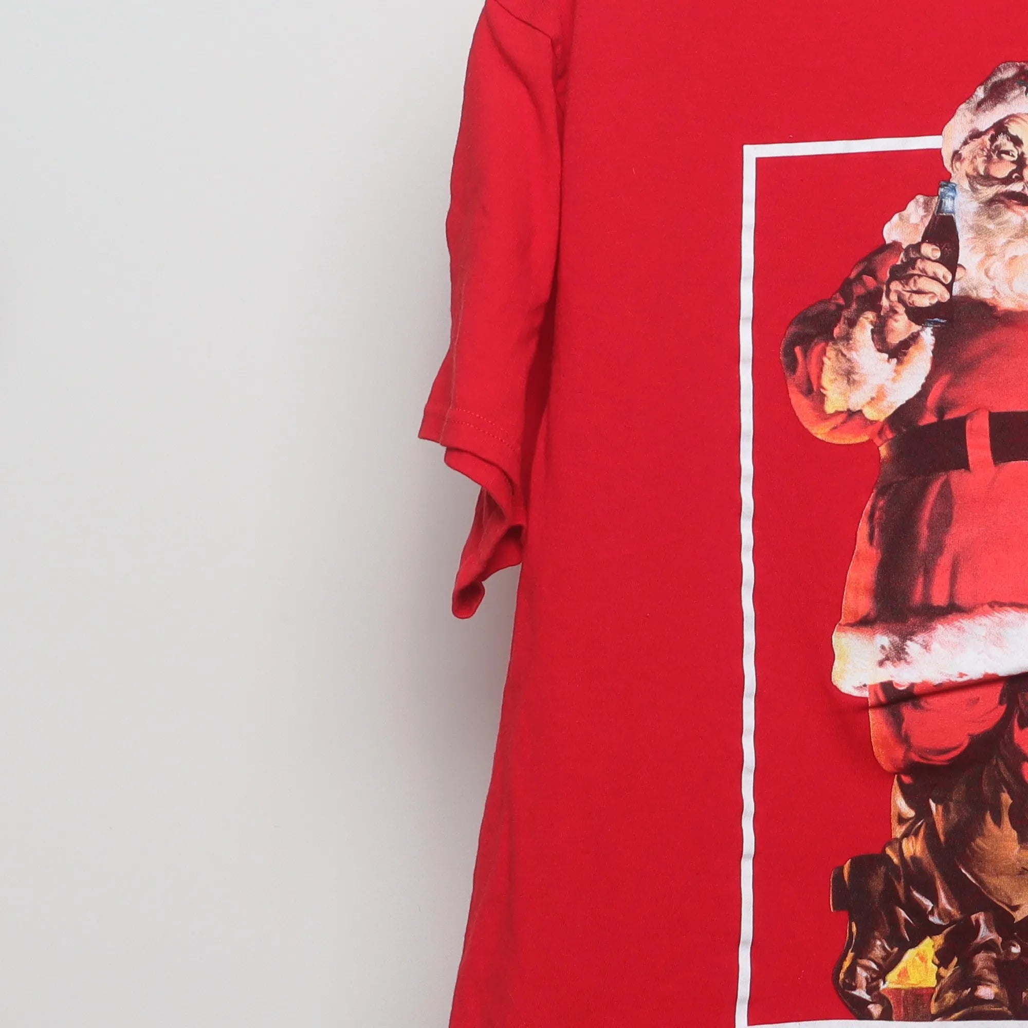 Close-up of the sleeve on the Vintage Coca-Cola Santa Claus Graphic Tee L