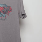 Close-up of the sleeve on the Vintage Eddie Bauer Bison Landscape Graphic Tee M