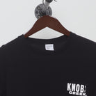 Close-up of the collar and tag on the Vintage Y2K Knob Creek "Every Bit Earned" T-Shirt - XS