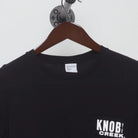 Close-up of the collar and tag on the Vintage Y2K Knob Creek "Every Bit Earned" T-Shirt - XS