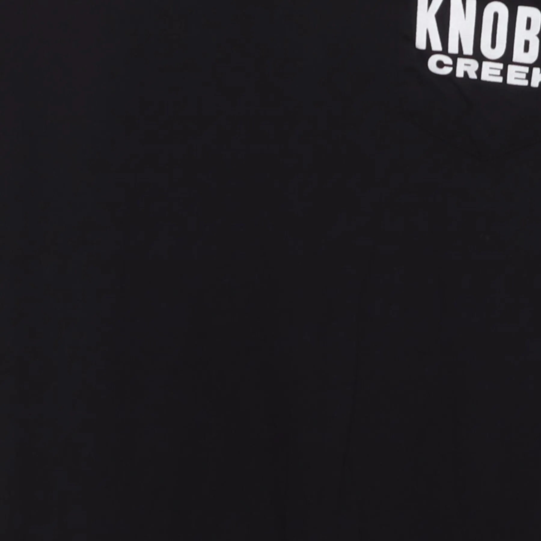 Close-up of the main graphic on the Vintage Y2K Knob Creek "Every Bit Earned" T-Shirt - XS